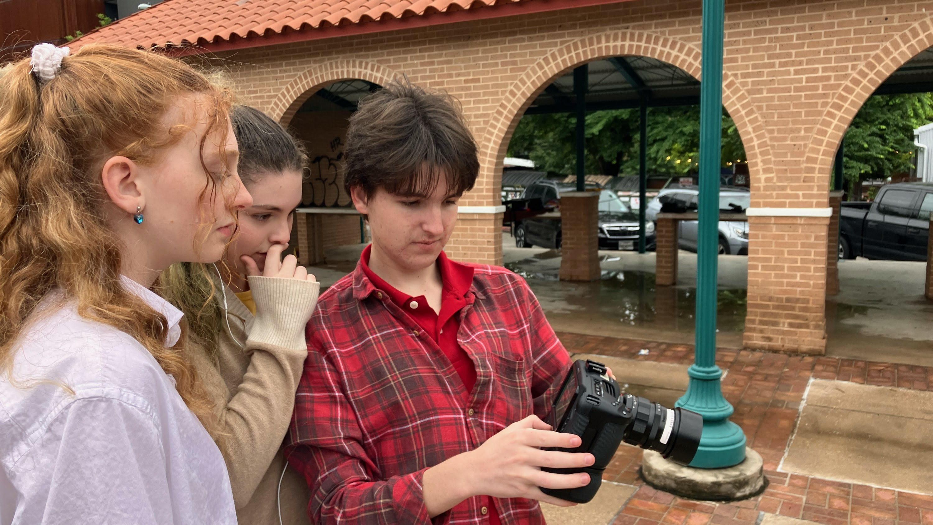 Alistair Sharp reviewing footage on set with crew